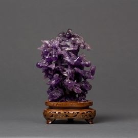 A CARVED AMETHYST SNUFF BOTTLE WITH BIRDS
