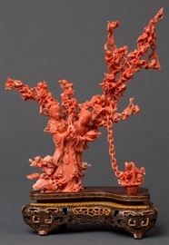 A CHINESE CARVED CORAL FIGURAL GROUP