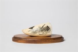 A SCRIMSHAW WHALE TOOTH SIGNED PETERSON 80