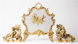 A FRENCH GILT BRONZE FIREPLACE SCREEN AND CHENETS