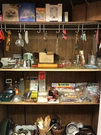 kitchen items. measuring cups, roll pins, stir sticks and more