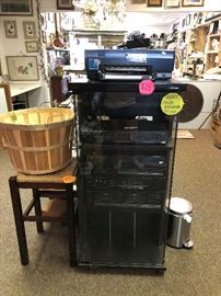 stereo stand filled with electronics. printers, record player, stereo sytems
