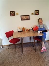 Retro table with 2 red chairs