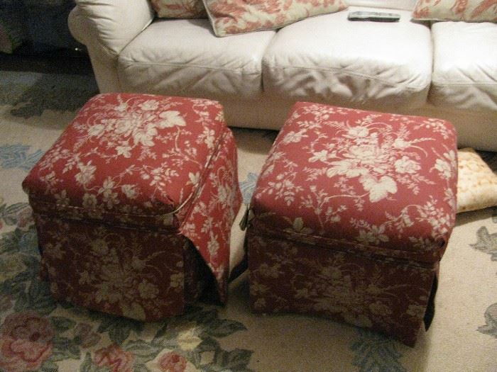 pair of upholstered ottomans in red toile fabric