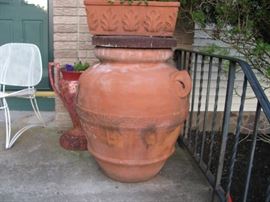 one of a pair of supersized terra cotta urns