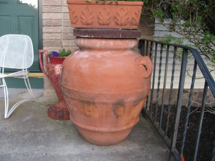 one of a pair of supersized terra  cotta urns