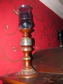 one of a pair of inlaid chinese bronze candlesticks with blue glass holders