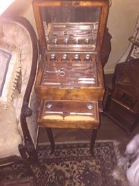 Antique rare necessities box on legs full of silver topped bottles and manicure items with secret drawer
