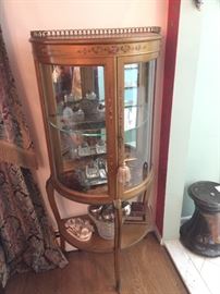 Wonderful French curved curio cabinet with some of the great antique inkwells