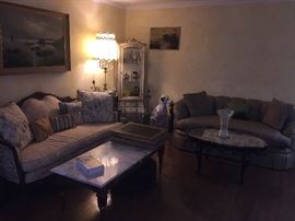 Living room couches one gold with wood frame the other silver silk in modern design