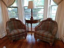 Pair of tweed upholstered armchairs and a mahogany demi-lune flip top table and marble table lamp