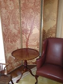 Mahogany pie crust table, leather armchair and tall four panel room divider screen
