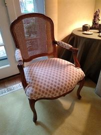 Cane back open armchair