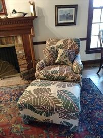 Upholstered armchair and ottoman