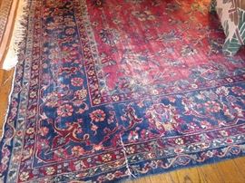 Antique Sarouk Persian rug, cut down to fit room size, show wear
