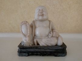 White jade Buddha on soapstone base
