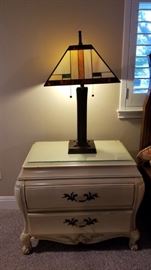 Bedside table and Tiffany-style lamp. There are 2 of each in the sale. 