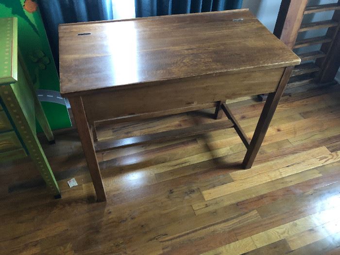 old desk with storage under the top. See the hinges???