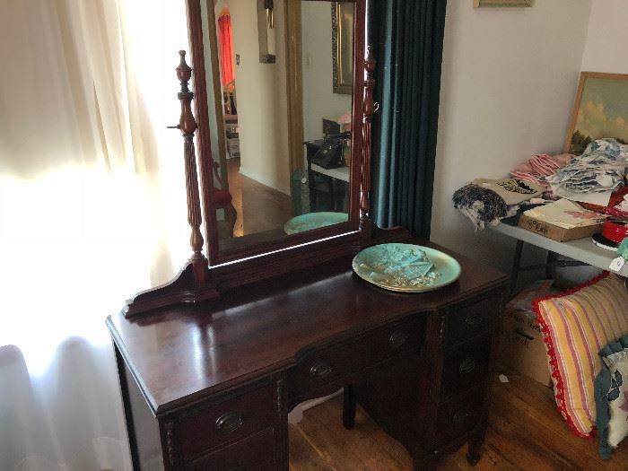 Very cool and unique dresser. It appears to be mahogany.