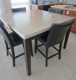 Tall counter top table with four chairs