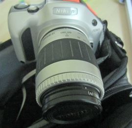 Nikon camera with two lenses and bag