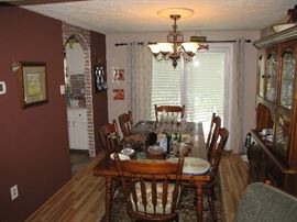 Dining room set with 6 chairs & table leaf. 