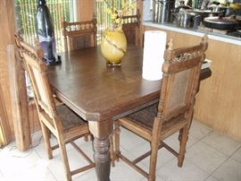 Vintage Leather and Wood Dinette. Table is on wheels.