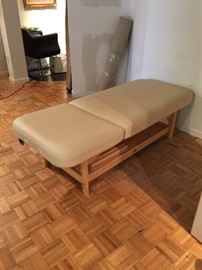 Massage table with adjustable legs and attachable head rest