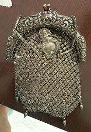 detail of chain mail purse with silver frame