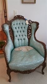 amazing upholstered arm chair in a lovely pale turquoise, very unusual but is the color of the day....and....wait for it...