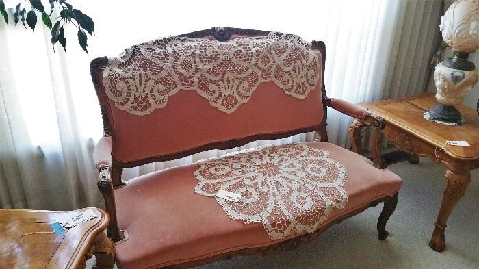 sweet pink upholstered settee, very sturdy!  antique lace