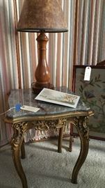 marble topped side table, gilt painted wooden base...crewel needlepoint fireplace screen...table lamp