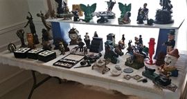 table in dining room with cast iron banks etc