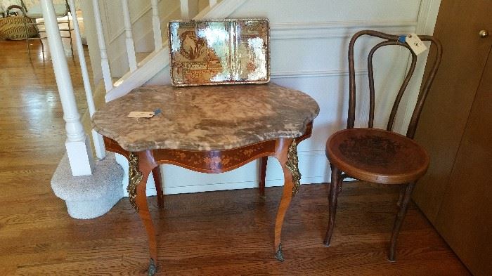very wonderful entry or center table with gray and rose marble top, marquetry around the sides and figural ormolu....bent wood chair