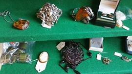 detail of amber pieces - pressed black glass medallion necklace