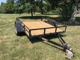 Utility trailer with pull out ramps