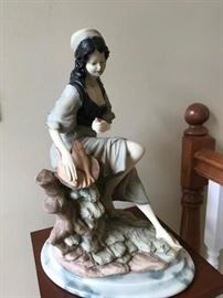 Figurine of a girl with fish