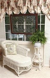 Lovely wicker chaise and plant stand.