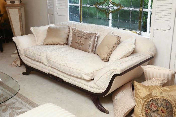 Carved Regency style sofa, down cushion.