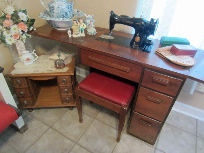 Vintage sewing machine with cabinet and note the converted sewing machine cabinet on wheels.