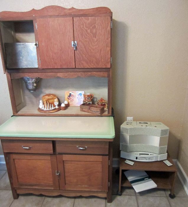 Reworked Hoosier cabinet with original sifter and porcelain top.  Vintage Bose radio, cassette player, and CD player  (Hoosier cabinet pulled from sale by heir)