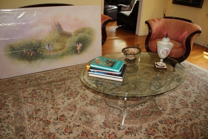 Art and Round Metal & Glass Coffee Table with Handmade Rug, Decorative Items and Books