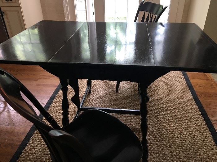 Antique Black Mahogany Drop Leaf Table with three matching Chairs