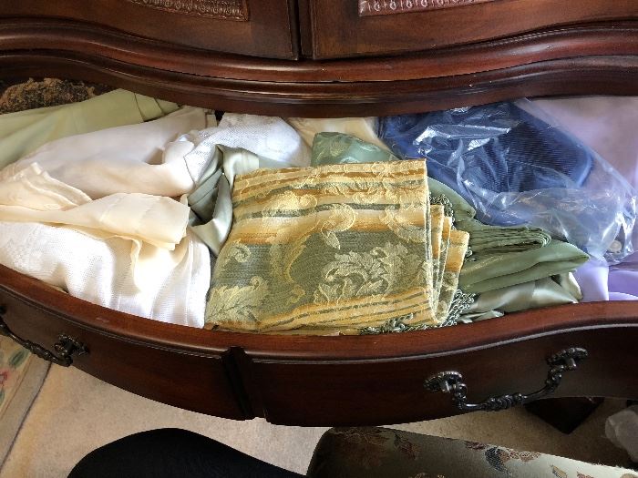drawers and cabinets full of curtains, sheers, and linens