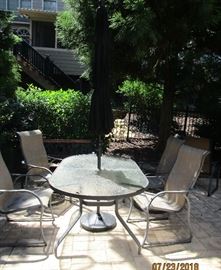 outdoor table and chairs and umbrella