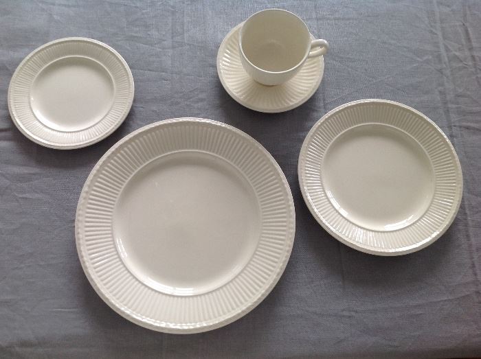 WEDGEWOOD CREME DISHWARE: Set of 12, 5-piece place settings. Each 5-piece place setting consists of: One dinner plate: 10.5". One salad/dessert plate: 8 1/8". One bread plate: One Cup. 6 3/8". One saucer. 5.75". 8 soup bowls included. Excellent, clean condition. No chips.