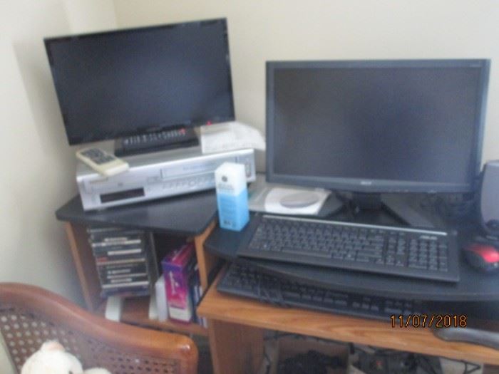 Small flat screen TV and computer monitor and keyboards