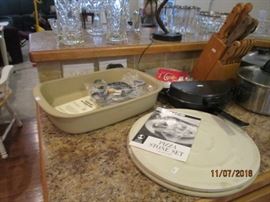 Pampered Chef baker and other stoneware pizza cooker