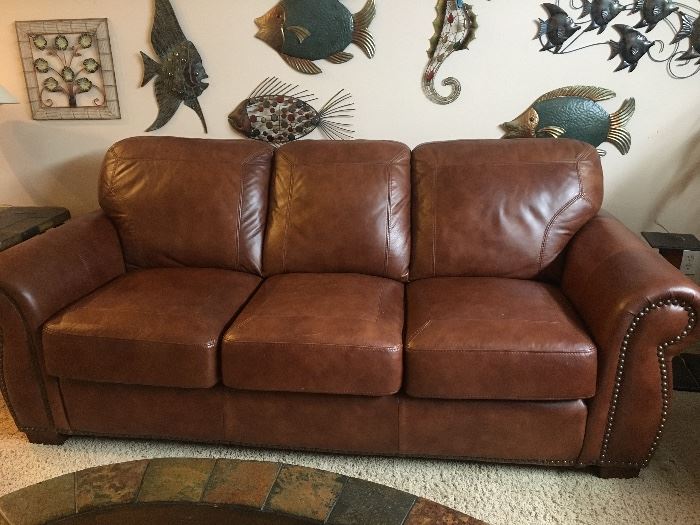 Leather couch and love seat that look brand new.