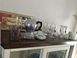 Various household decorations, crystal, glasses and other serving items. The curio cabinet is also for sale.